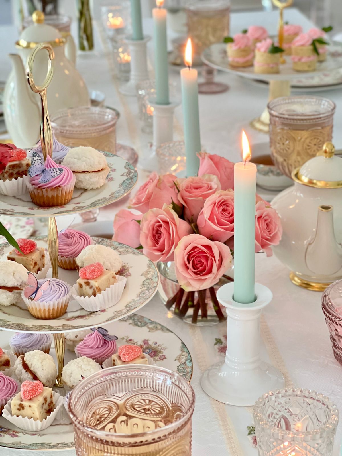 A long table styled for afternoon tea in a modern Miami residence