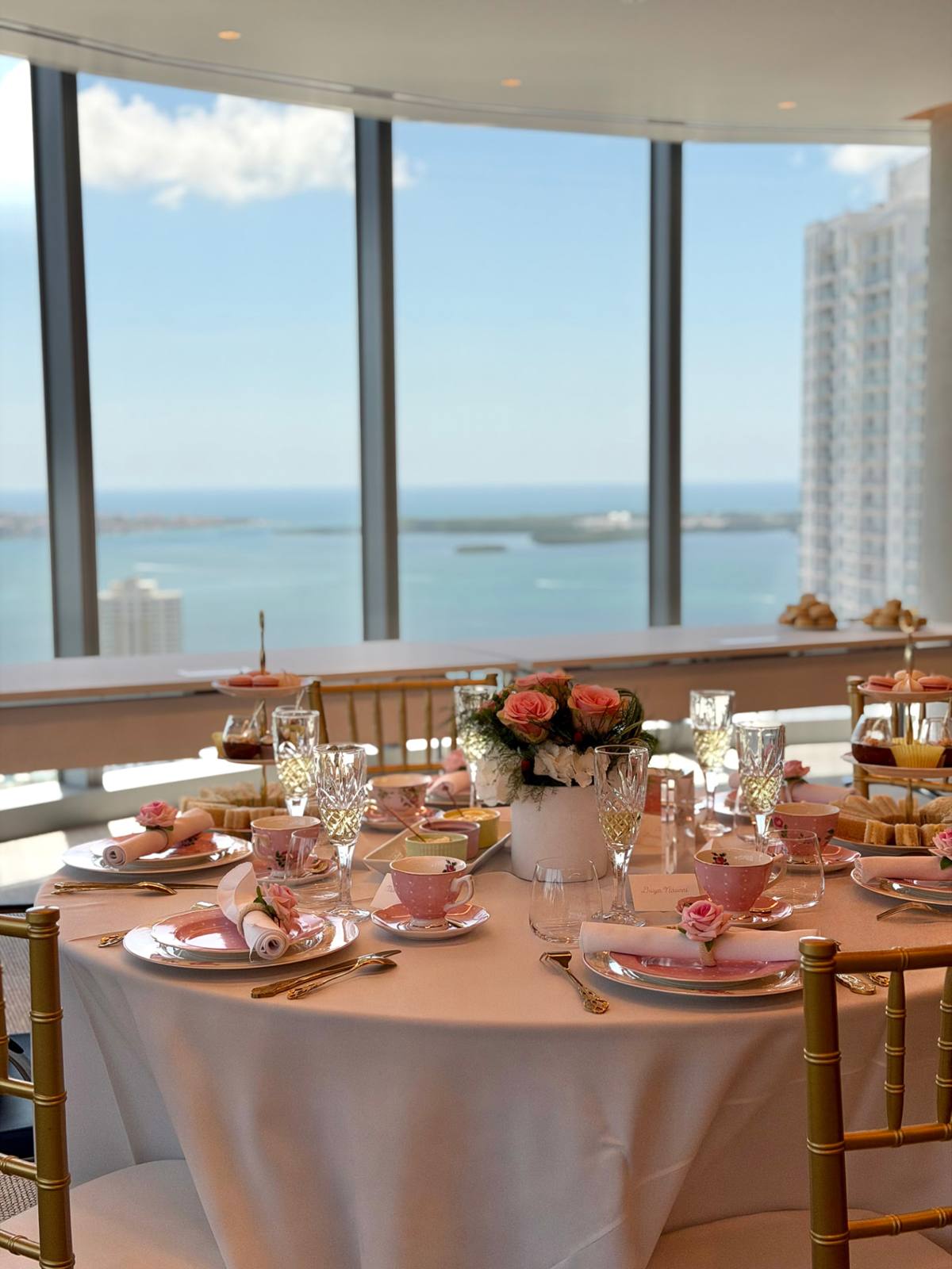 A tea table styled in front of a panoramic bay view