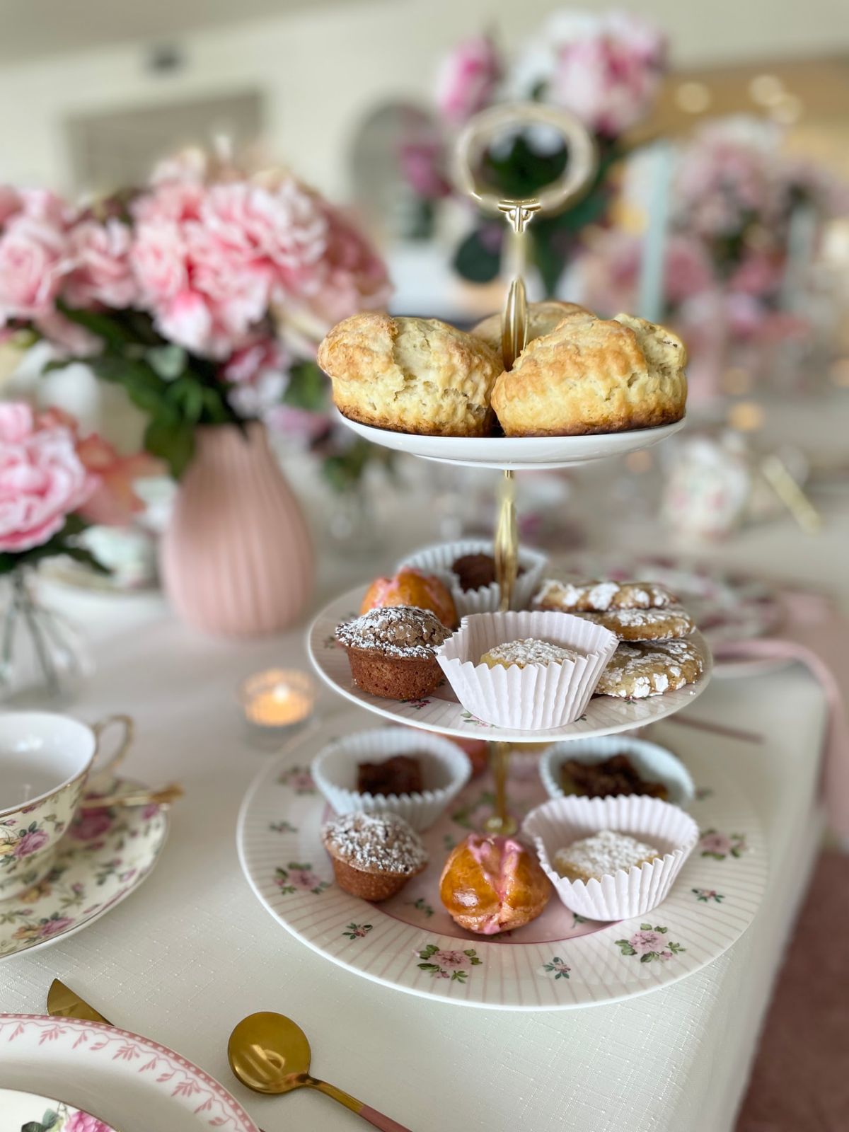 Scones and pastries on a floral tiered stand